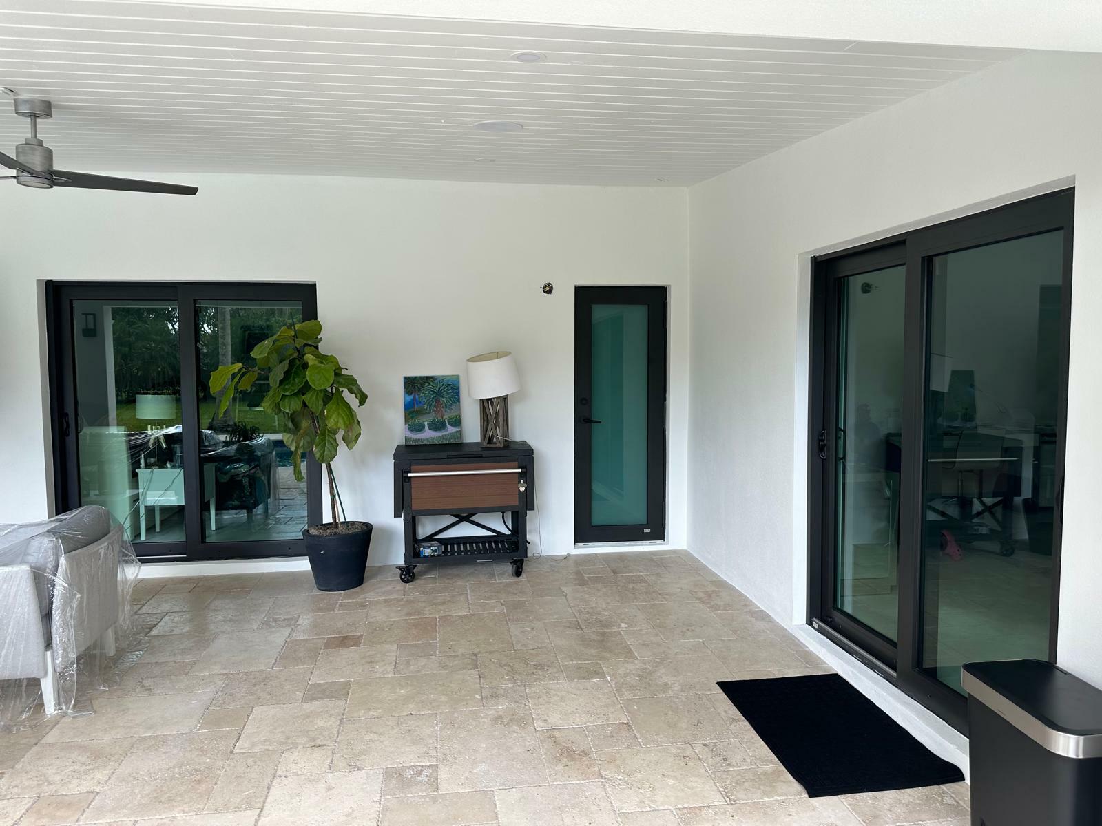 2 sliding glass bronze and small door in bronze